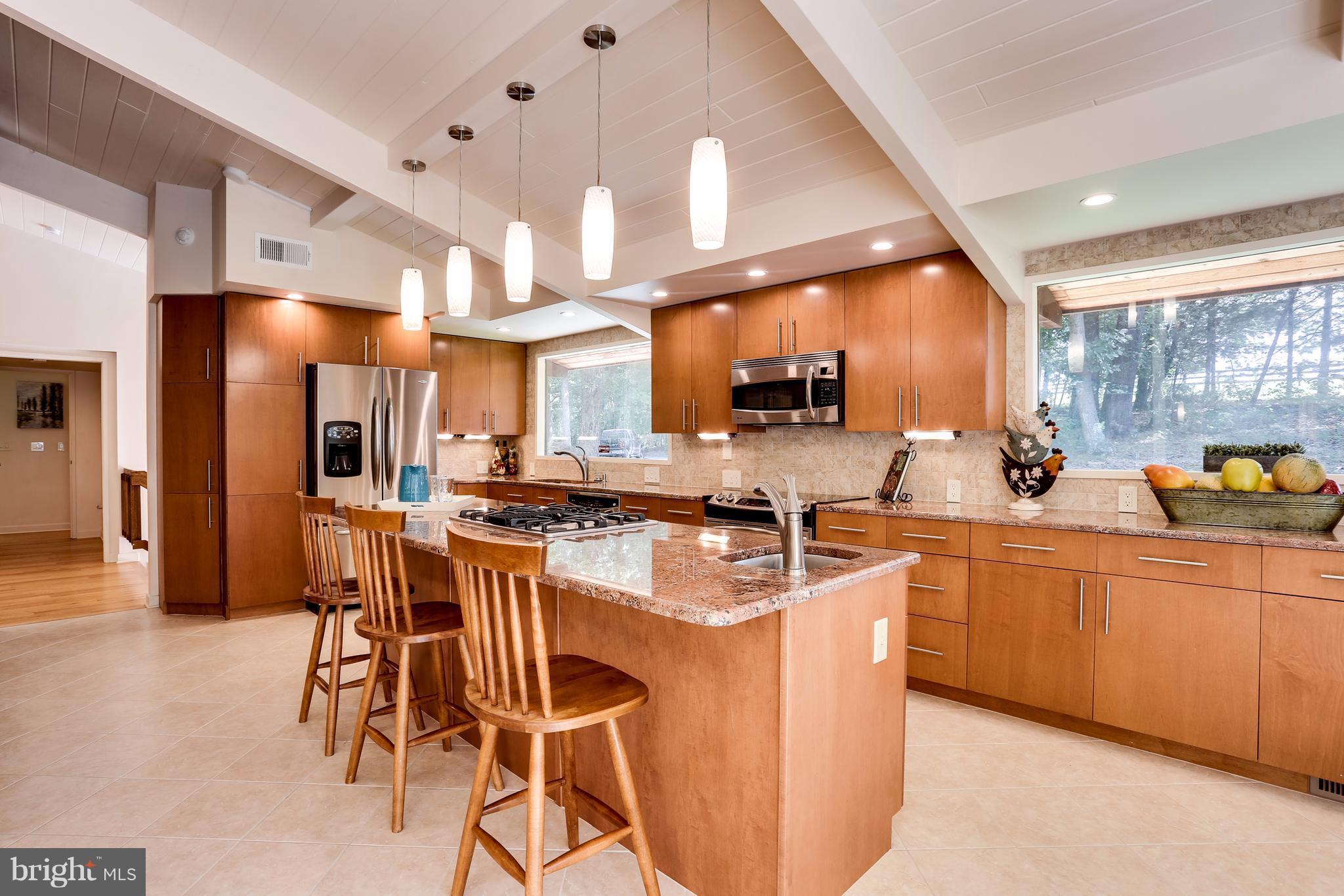 10900 Moxley Road Damascus, MD 20872 - Photo 12 of 30 a large kitchen with a table and chairs