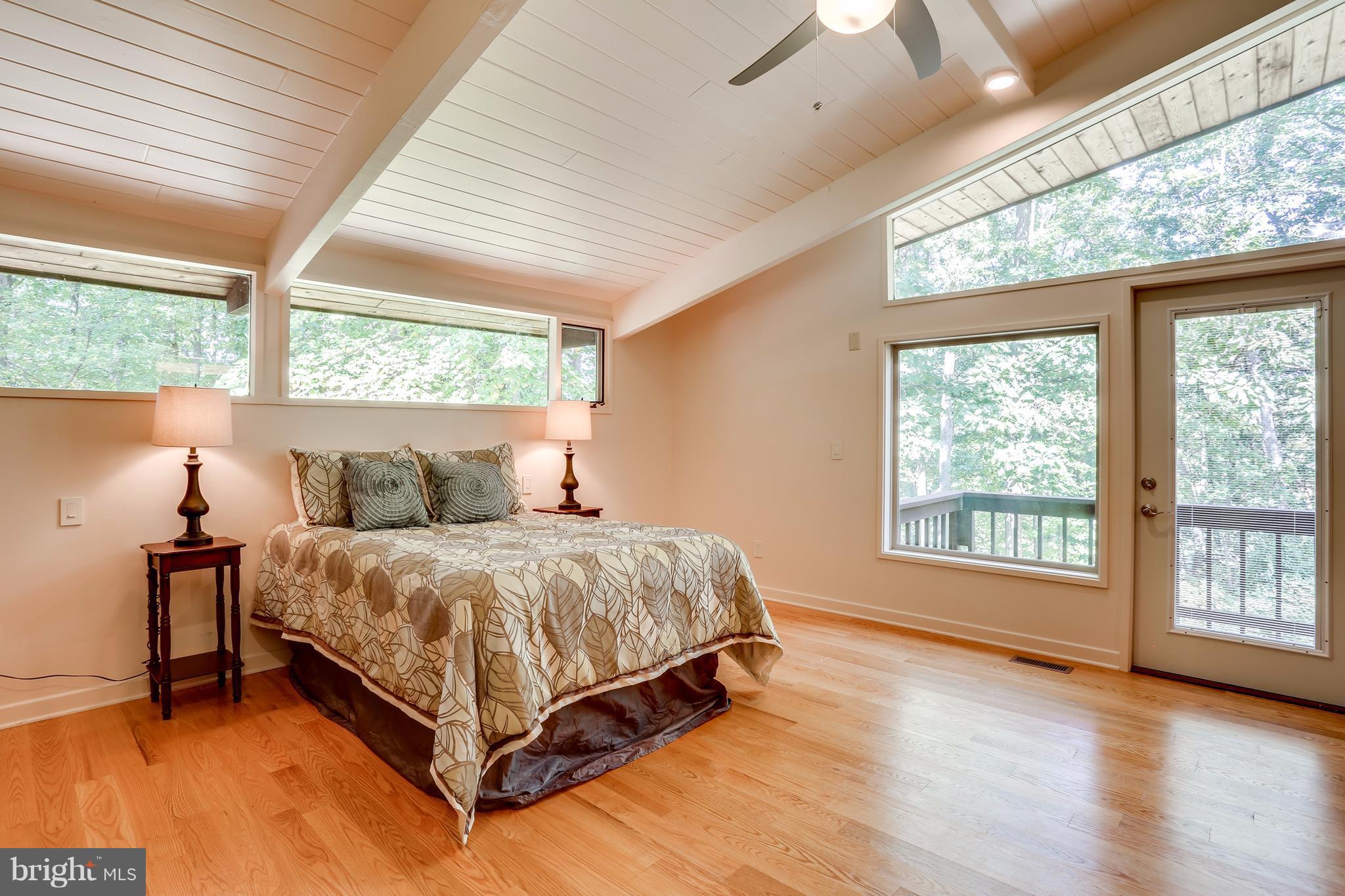 10900 Moxley Road Damascus, MD 20872 - Photo 15 of 30 a bed sitting in a spacious bedroom next to a window