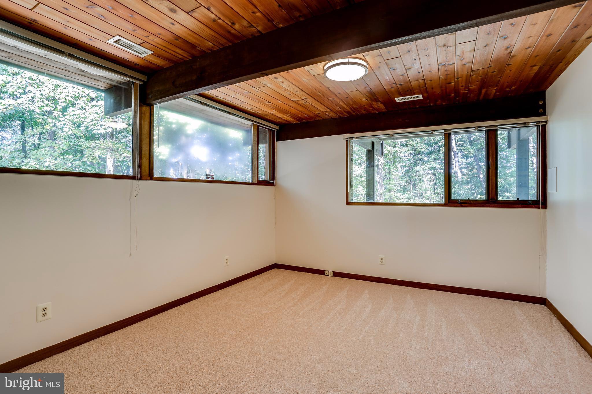 10900 Moxley Road Damascus, MD 20872 - Photo 22 of 30 a view of an empty room with a large window