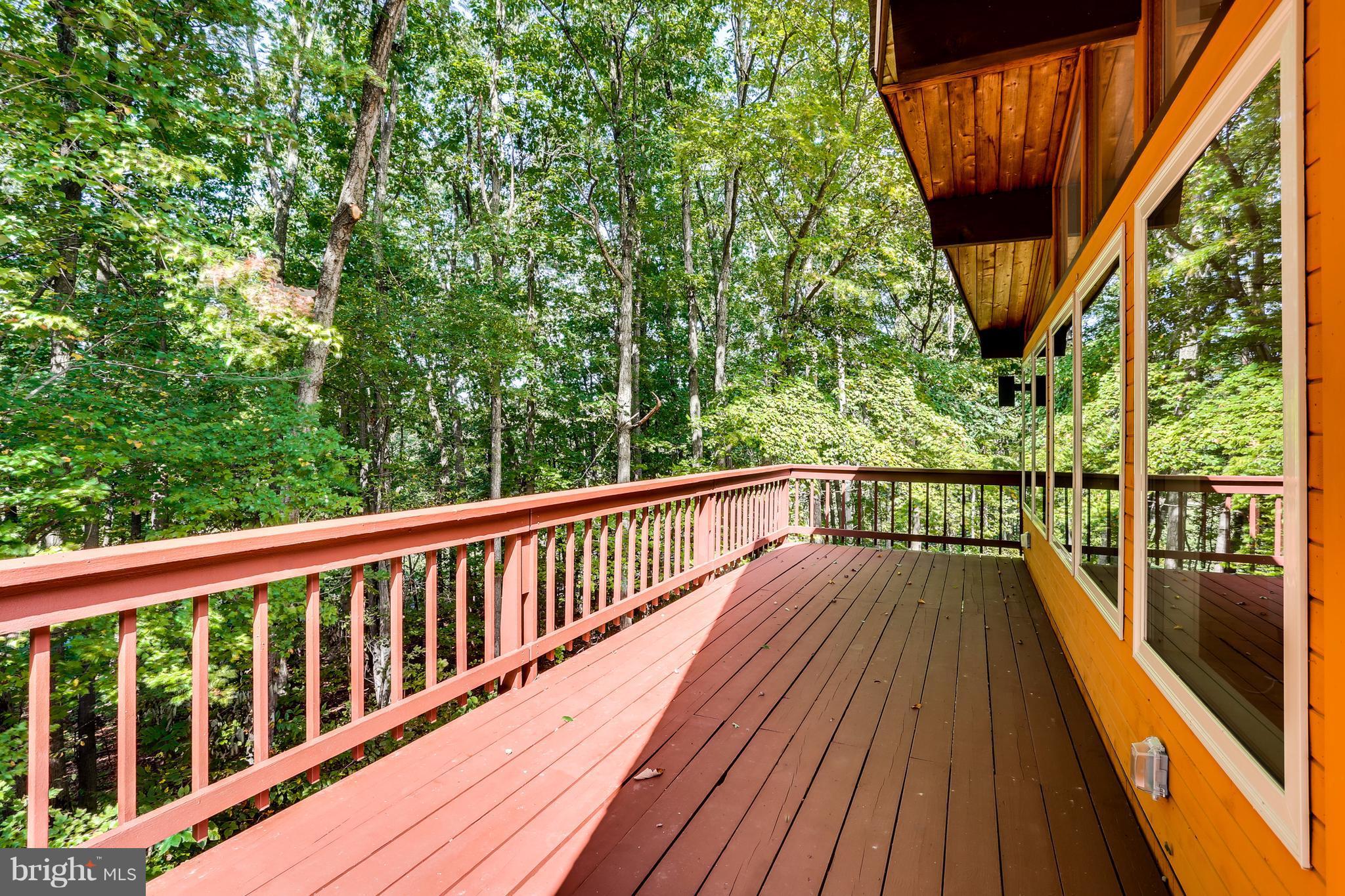 10900 Moxley Road Damascus, MD 20872 - Photo 28 of 30 a view of balcony with wooden floor and fence