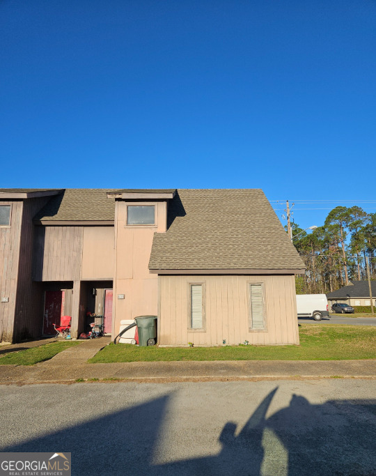 102 Valley Road Statesboro, GA 30458 - Photo 1 of 1 a view of a big house with a big yard and large trees