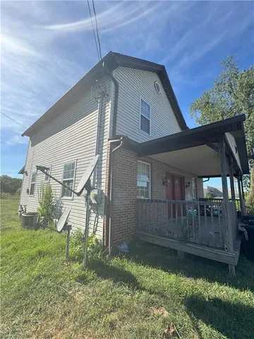 a house view with a garden space