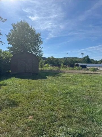a view of a lake with houses in background