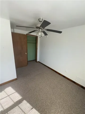 a view of a room with a air conditioner and stairs