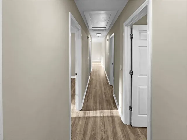 a kitchen with stainless steel appliances kitchen island granite countertop a refrigerator and a stove