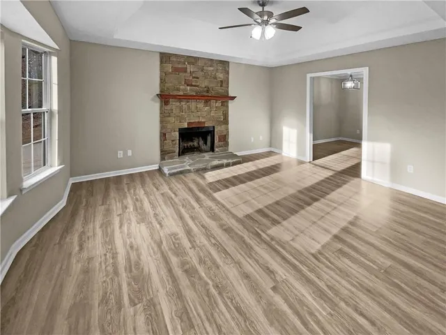 a view of an empty room and glass door