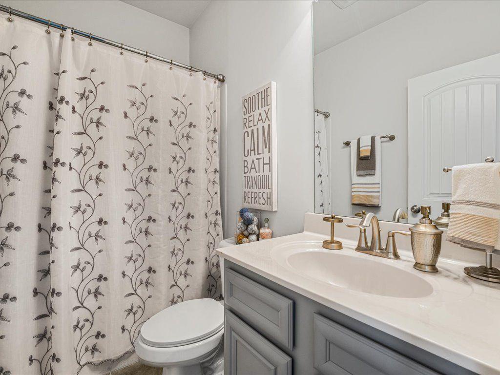 7675 Volion Drive Fairburn, GA 30213 - Photo 11 of 44 a bathroom with a sink toilet and shower