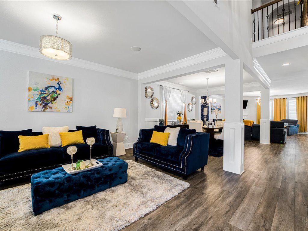 7675 Volion Drive Fairburn, GA 30213 - Photo 17 of 44 a living room with furniture and wooden floor