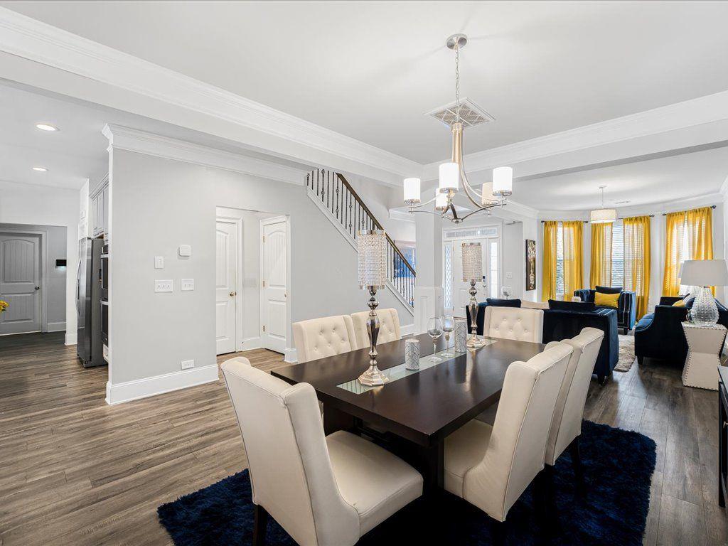 7675 Volion Drive Fairburn, GA 30213 - Photo 20 of 44 a view of a dining room with furniture and wooden floor