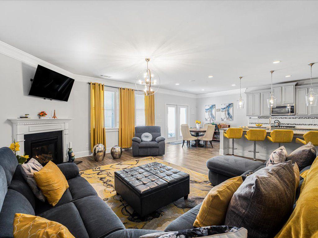7675 Volion Drive Fairburn, GA 30213 - Photo 2 of 44 a living room with furniture fireplace and flat screen tv