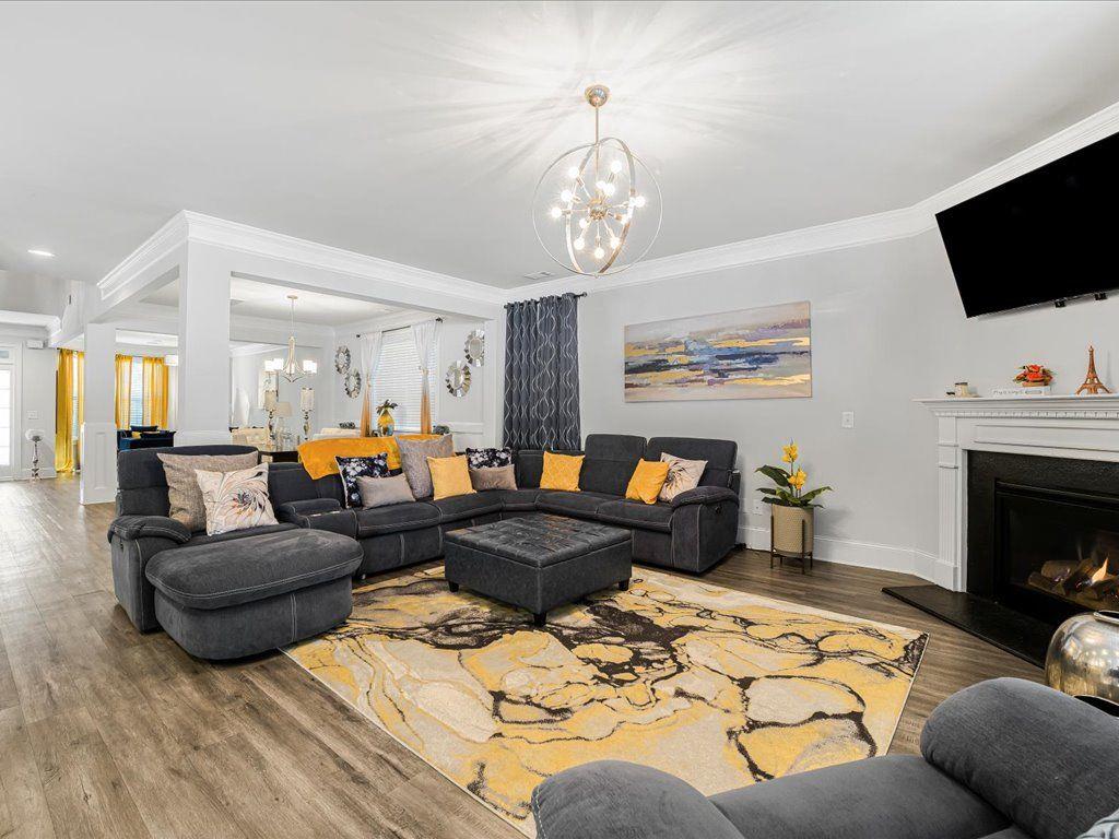 7675 Volion Drive Fairburn, GA 30213 - Photo 23 of 44 a living room with furniture fireplace and flat screen tv