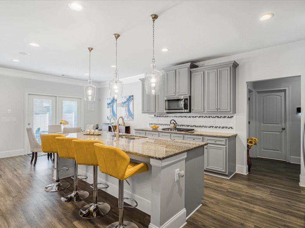 7675 Volion Drive Fairburn, GA 30213 - Photo 25 of 44 a large kitchen with a table and chairs in it