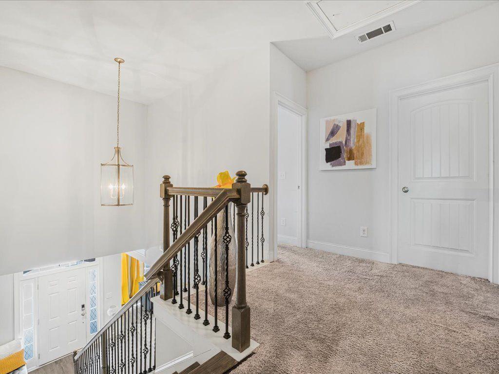 7675 Volion Drive Fairburn, GA 30213 - Photo 29 of 44 a view of hallway with stairs