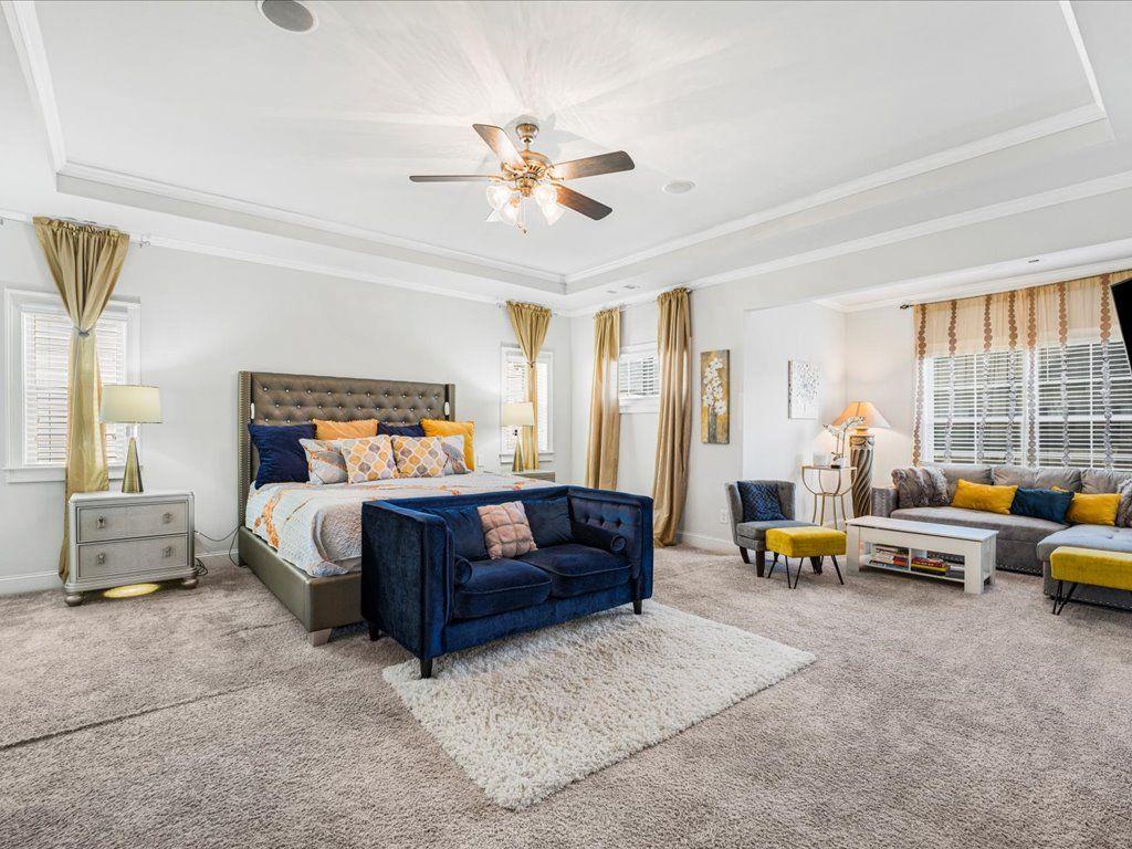 7675 Volion Drive Fairburn, GA 30213 - Photo 33 of 44 a bedroom with furniture and large windows