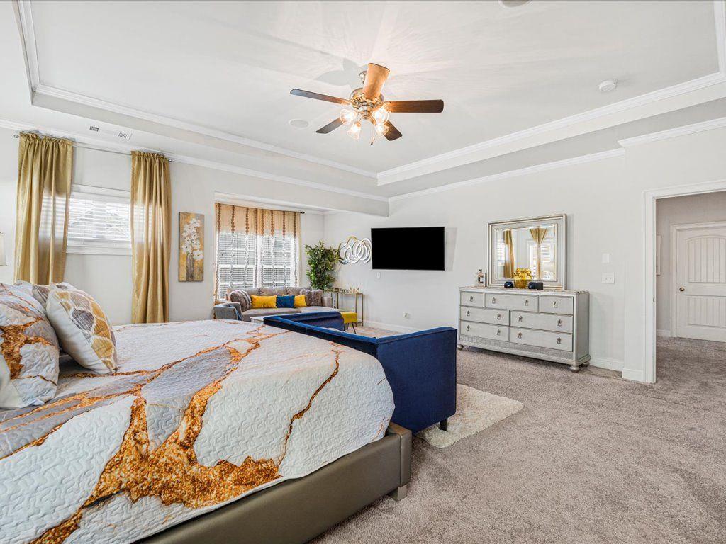 7675 Volion Drive Fairburn, GA 30213 - Photo 35 of 44 a bedroom with a bed and a television