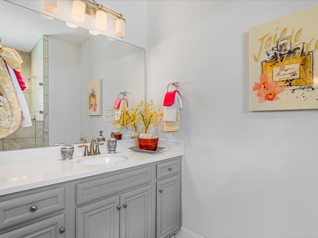 7675 Volion Drive Fairburn, GA 30213 - Photo 40 of 44 a bathroom with a sink and a mirror
