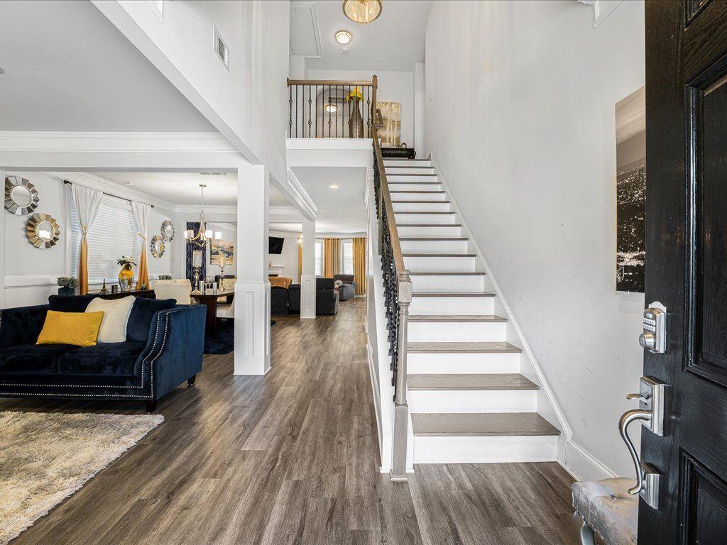 7675 Volion Drive Fairburn, GA 30213 - Photo 4 of 44 a living room with furniture and wooden floor