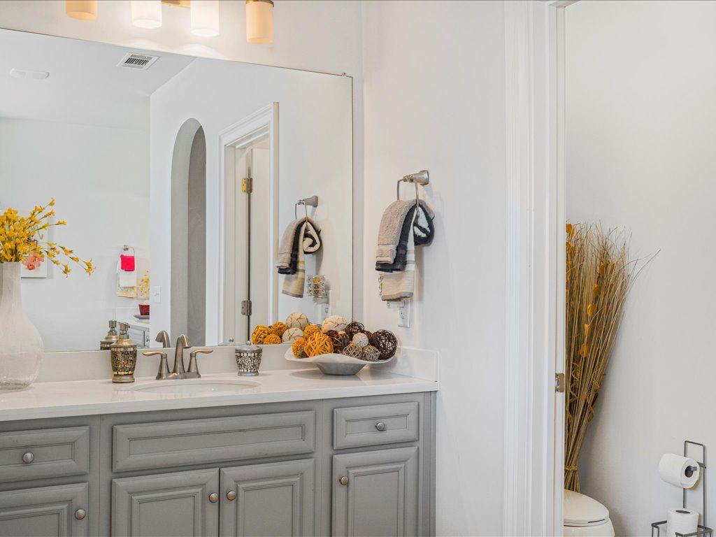7675 Volion Drive Fairburn, GA 30213 - Photo 41 of 44 a bathroom with a sink and a mirror