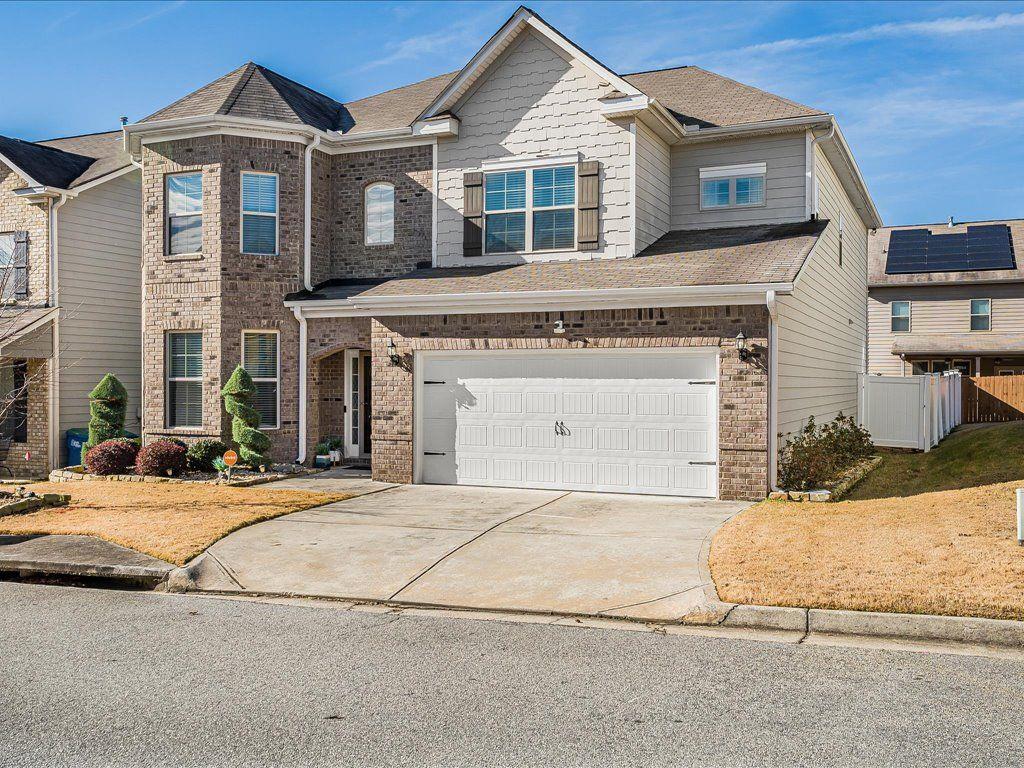7675 Volion Drive Fairburn, GA 30213 - Photo 44 of 44 a front view of a house with a yard