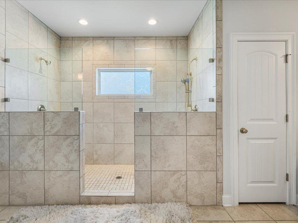 7675 Volion Drive Fairburn, GA 30213 - Photo 5 of 44 a bathroom with a shower