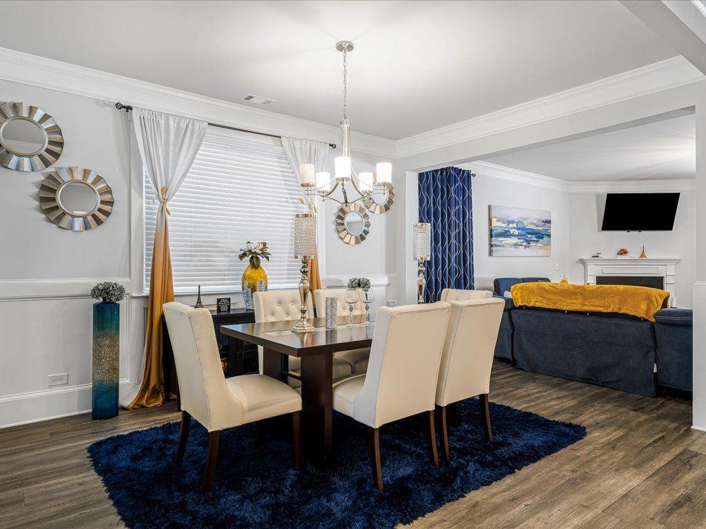 7675 Volion Drive Fairburn, GA 30213 - Photo 7 of 44 a view of a dining room with furniture window and wooden floor