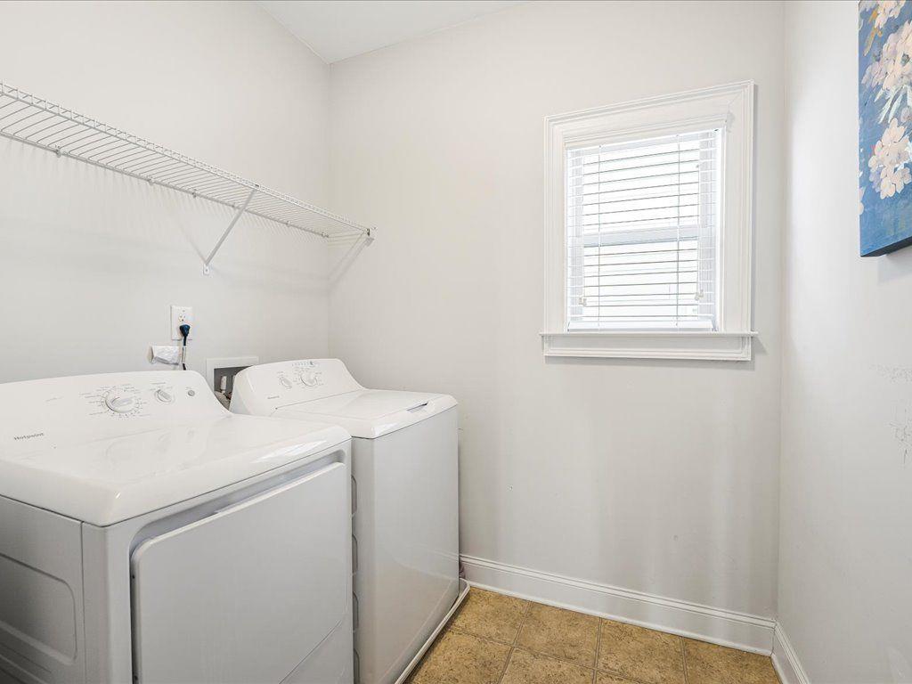 7675 Volion Drive Fairburn, GA 30213 - Photo 8 of 44 a utility room with dryer and washer