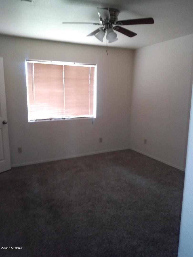 423 Teson Court Rio Rico, AZ 85648 - Photo 11 of 13 an empty room with a window