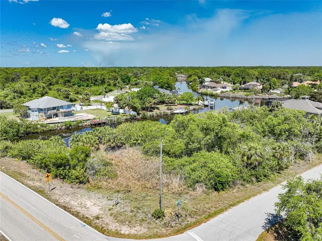 a view of a swimming pool with a yard