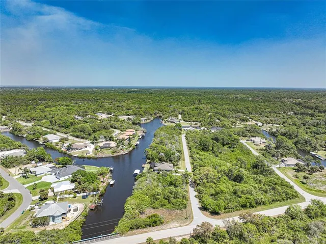 an aerial view of residential building and lake