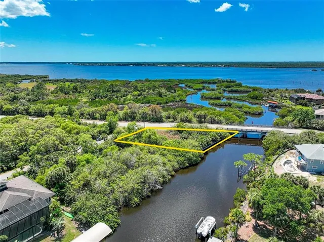 a view of a swimming pool with an outdoor seating