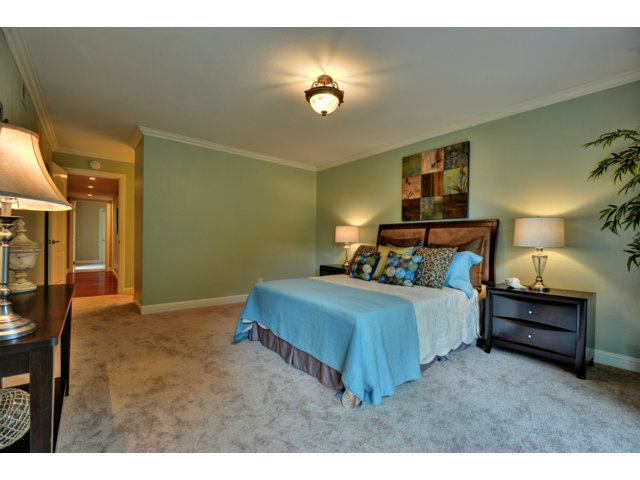 6182 Flowering Plum Road San Jose, CA 95120 - Photo 15 of 23 a bedroom with a bed and a lamp on table