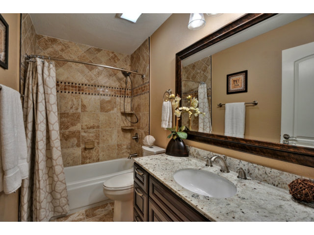 6182 Flowering Plum Road San Jose, CA 95120 - Photo 20 of 23 a bathroom with a granite countertop sink toilet and shower