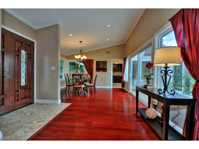 6182 Flowering Plum Road San Jose, CA 95120 - Photo 6 of 23 a living room filled with furniture and a wooden floor