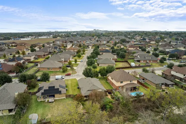 an aerial view of a city with lots of residential buildings