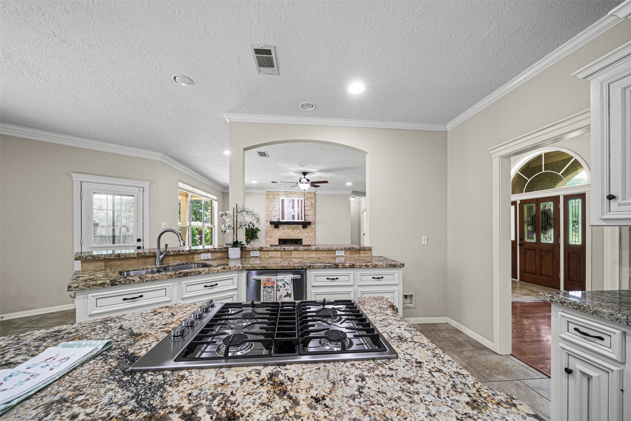 2452 Ripplewood Drive Conroe, TX 77384 - Photo 12 of 31 a kitchen with stainless steel appliances granite countertop a stove and cabinets