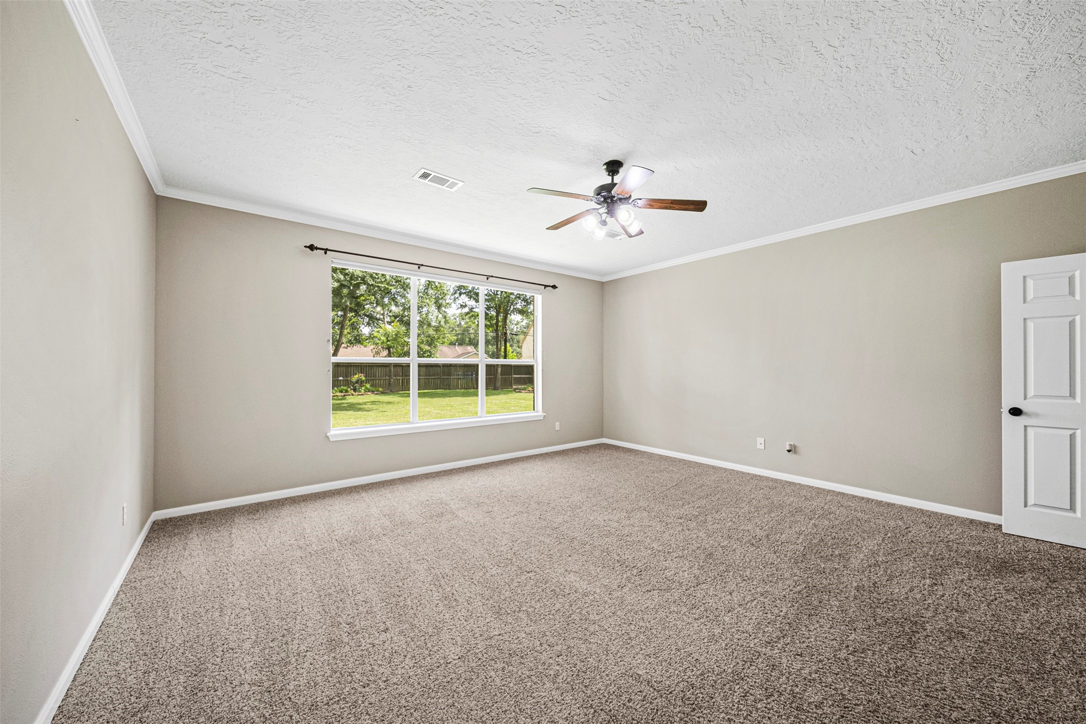 2452 Ripplewood Drive Conroe, TX 77384 - Photo 13 of 31 a view of an empty room with a window