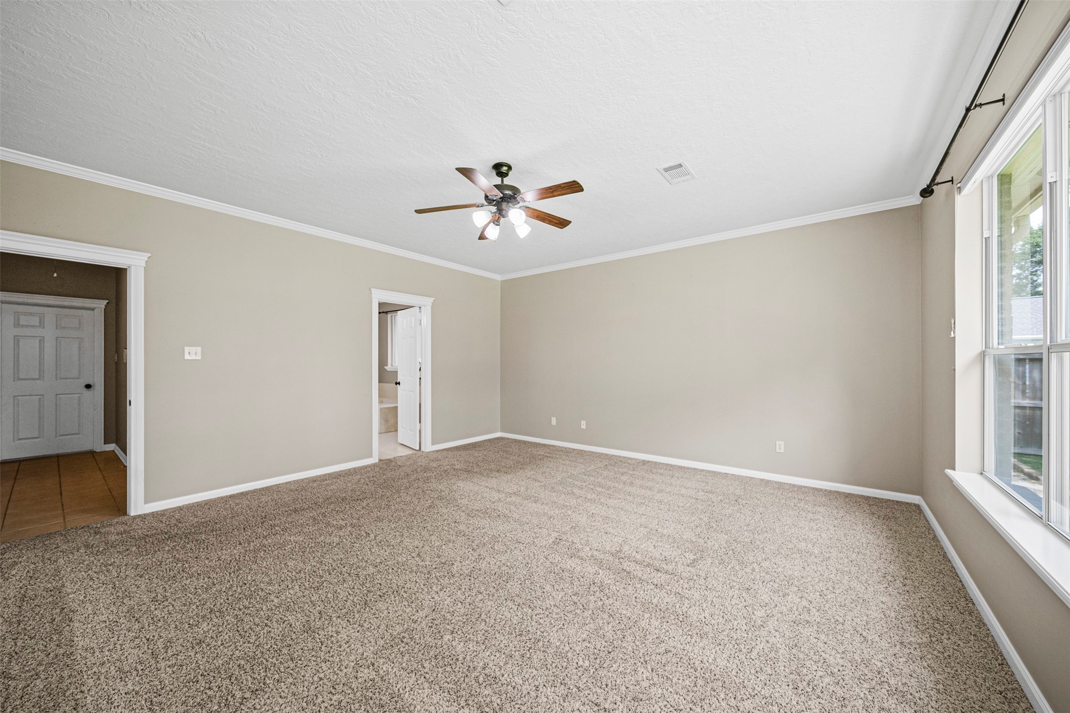 2452 Ripplewood Drive Conroe, TX 77384 - Photo 14 of 31 a view of an empty room with a window