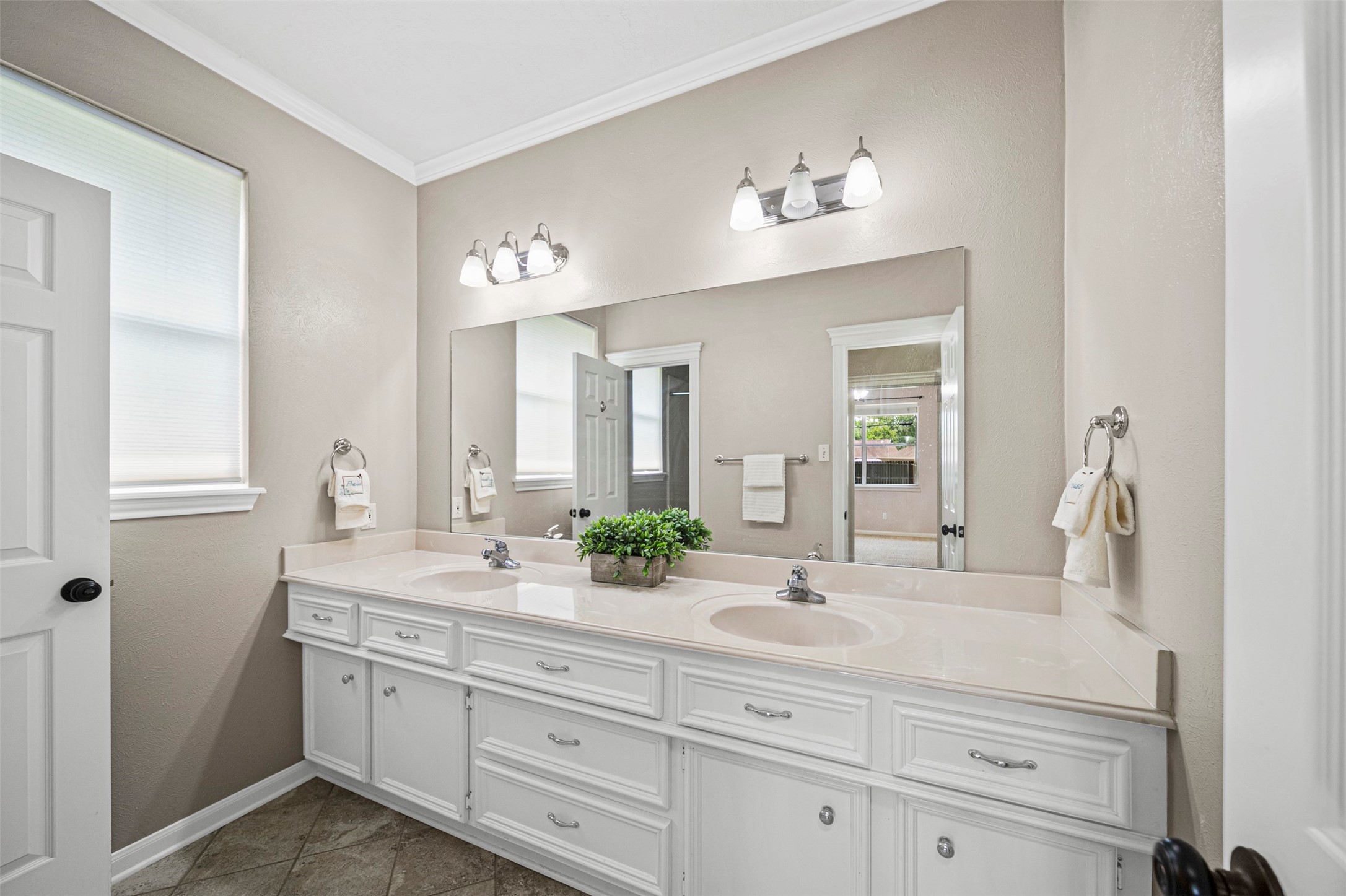 2452 Ripplewood Drive Conroe, TX 77384 - Photo 19 of 31 a bathroom with a sink and a mirror