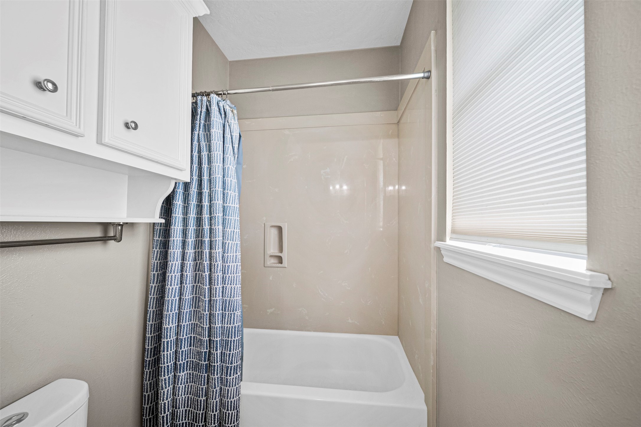 2452 Ripplewood Drive Conroe, TX 77384 - Photo 20 of 31 a bathroom with a shower and a toilet