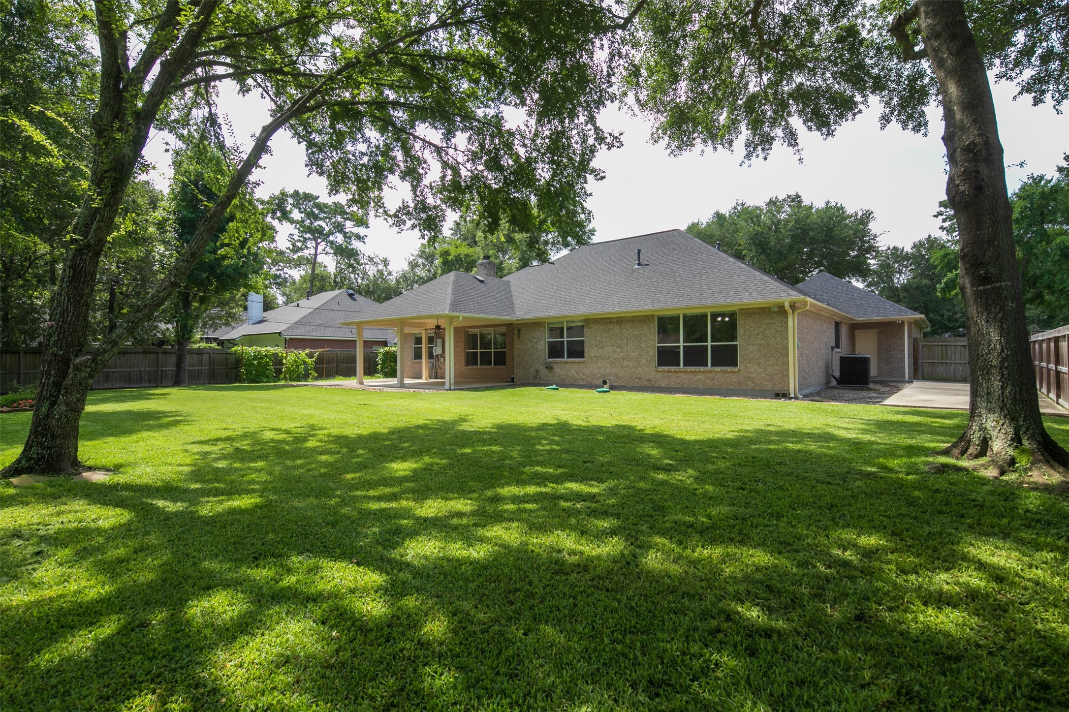 2452 Ripplewood Drive Conroe, TX 77384 - Photo 27 of 31 a front view of a house with a garden
