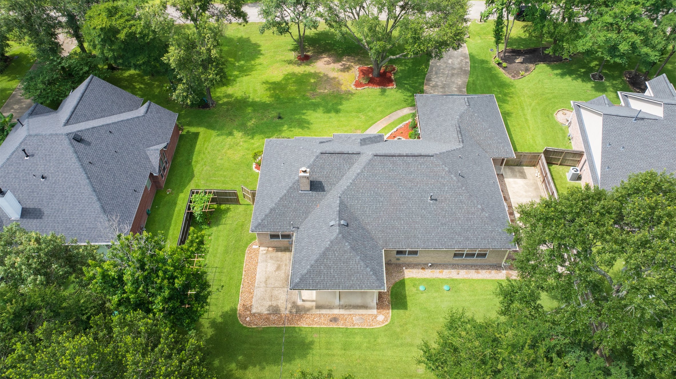 2452 Ripplewood Drive Conroe, TX 77384 - Photo 29 of 31 an aerial view of a house with a garden
