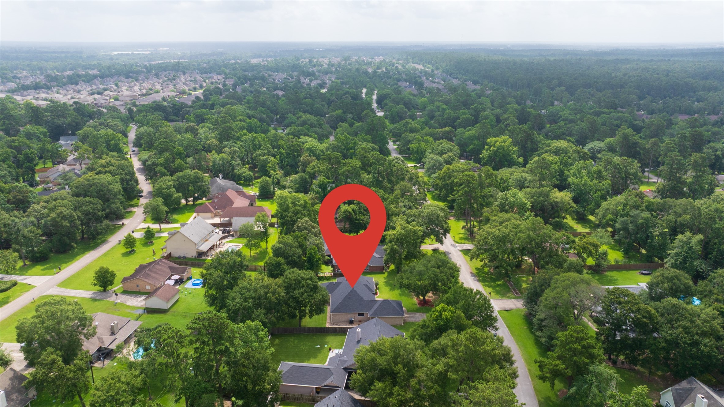 2452 Ripplewood Drive Conroe, TX 77384 - Photo 30 of 31 a view of outdoor space and city view