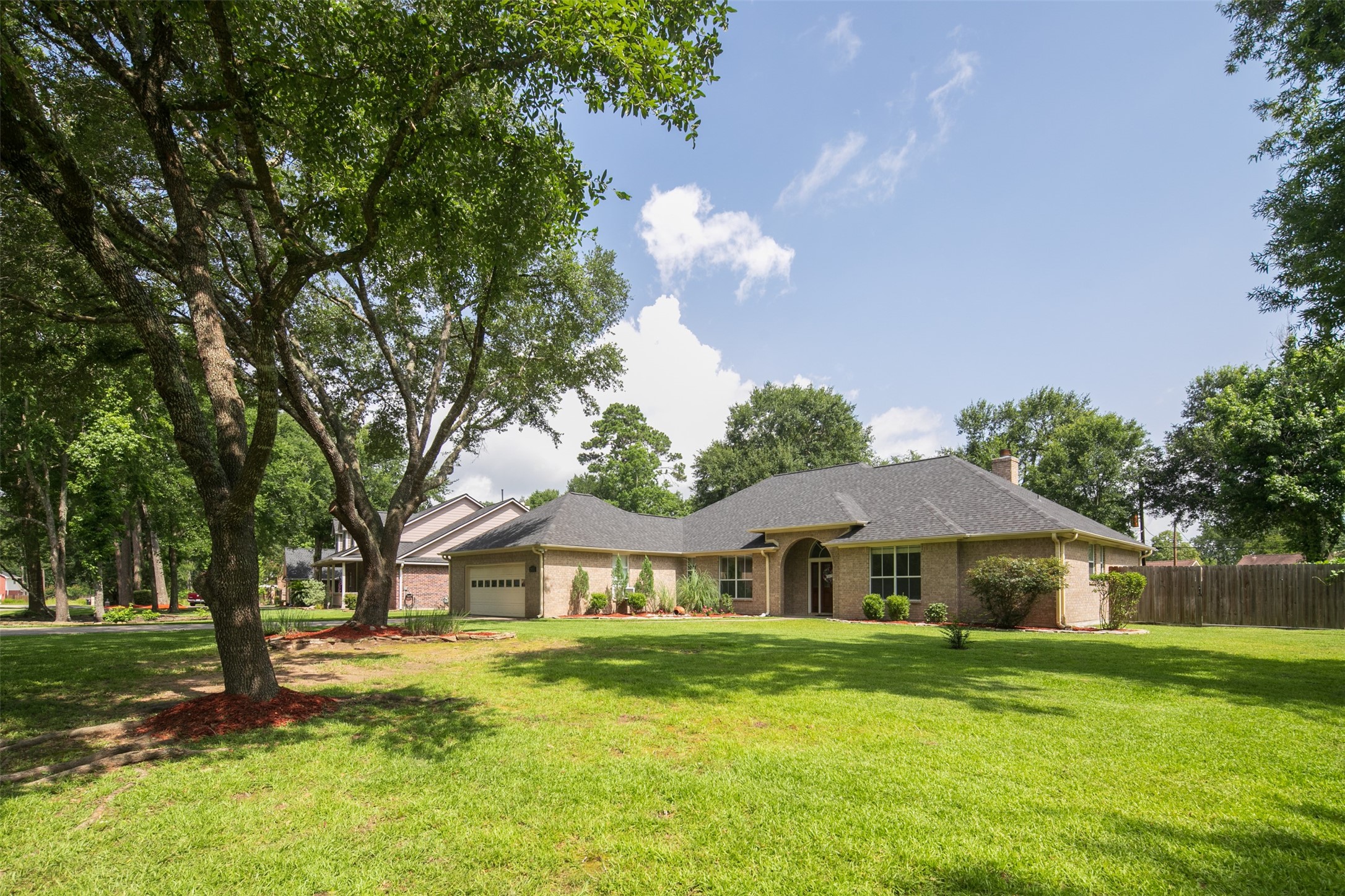 2452 Ripplewood Drive Conroe, TX 77384 - Photo 3 of 31 a front view of a house with garden