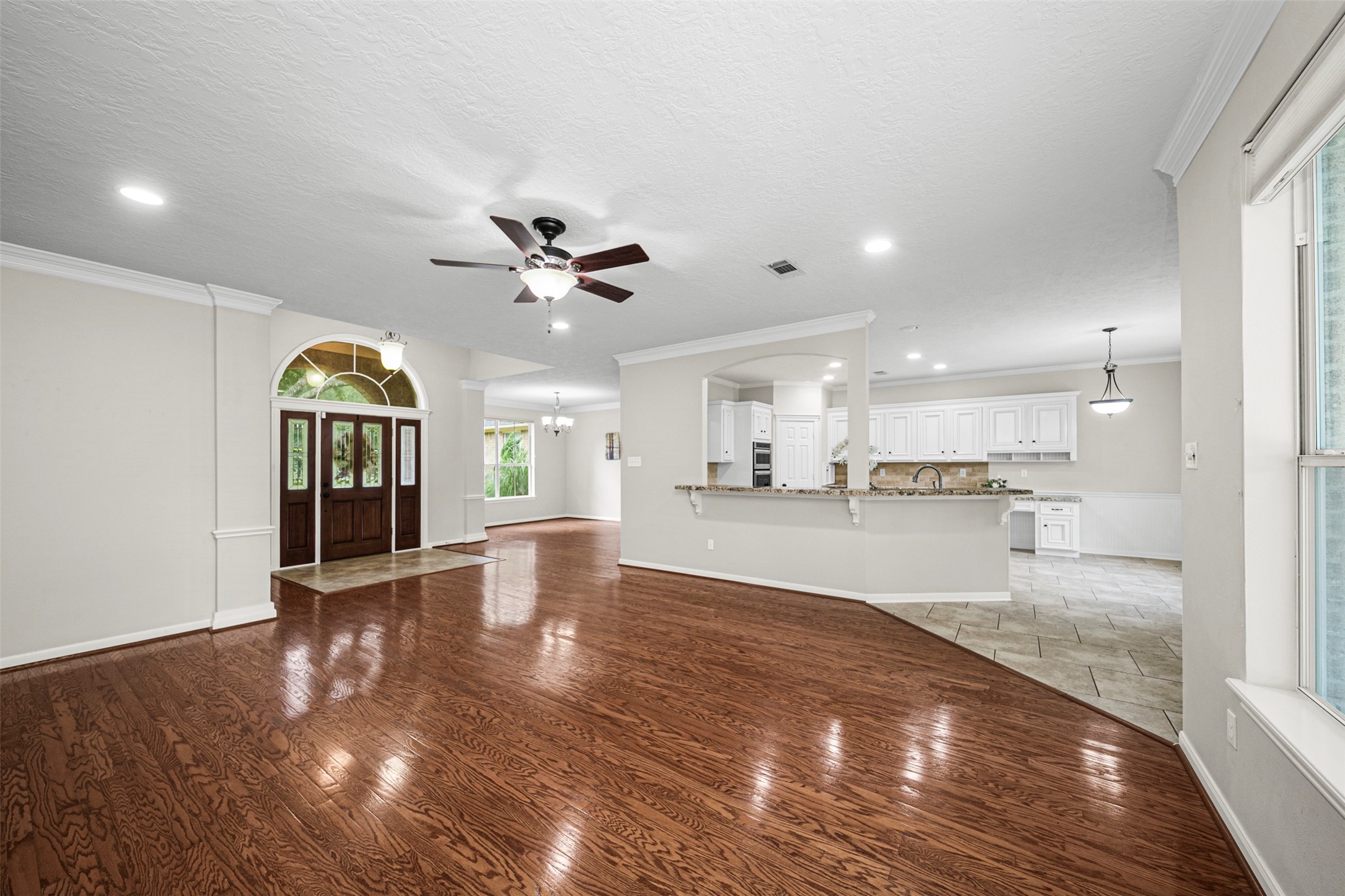 2452 Ripplewood Drive Conroe, TX 77384 - Photo 5 of 31 a view of large kitchen with a sink wooden floor and a kitchen