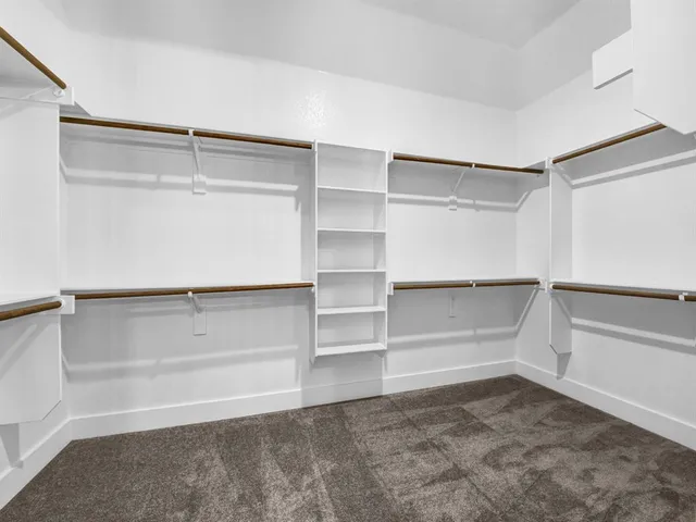 a view of an empty walk in closet