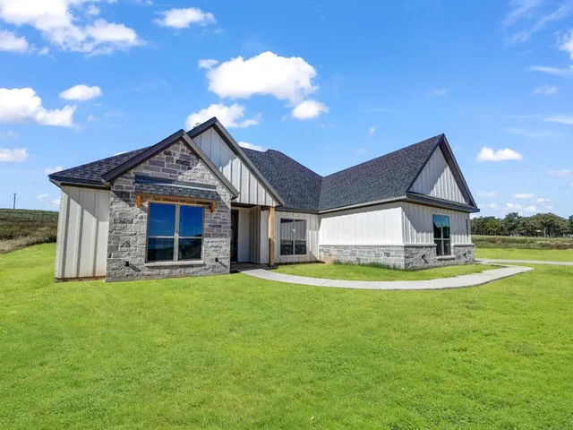 a view of a house with a yard porch and sitting area