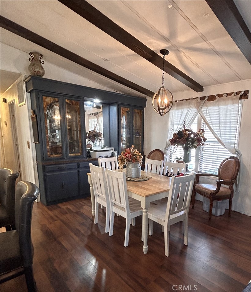31816 Avenue E, Unit 135 Yucaipa, CA 92399 - Photo 4 of 12 a view of a dining room with furniture window and wooden floor