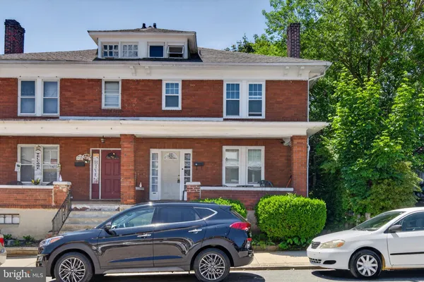 a front view of a house with parking space