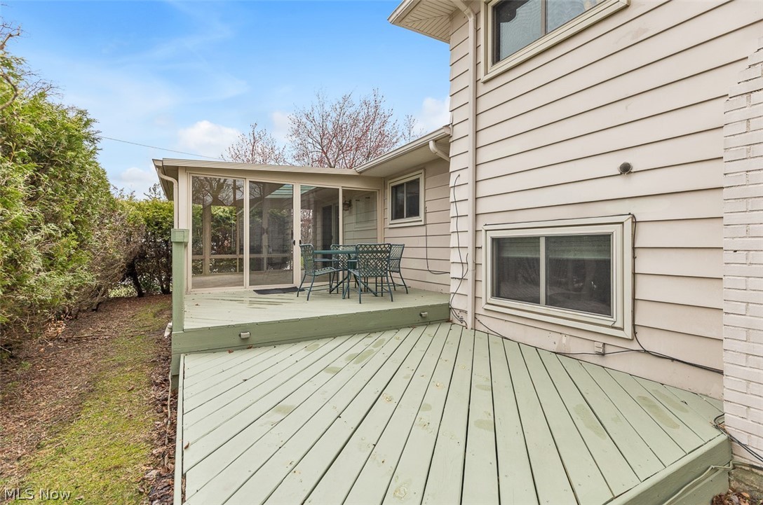 2990 Hampton Road Cleveland, OH 44120 - Photo 3 of 29 Deck with a sunroom and outdoor dining area