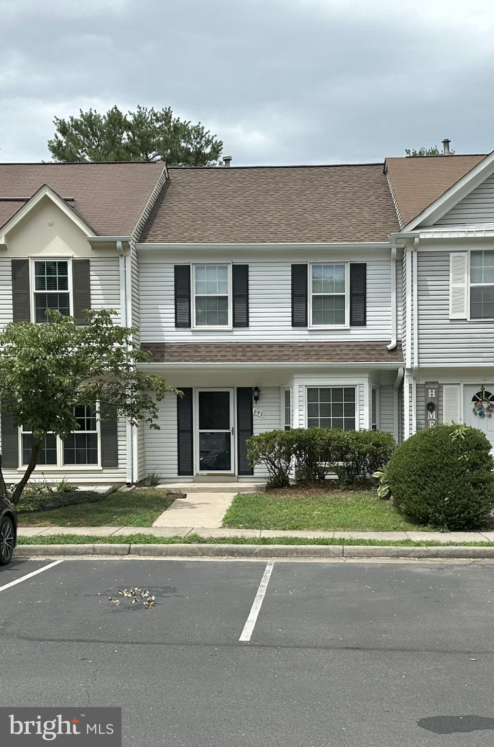 892 Smartts Lane Northeast Leesburg, VA 20176 - Photo 1 of 23 a front view of a house with a garden